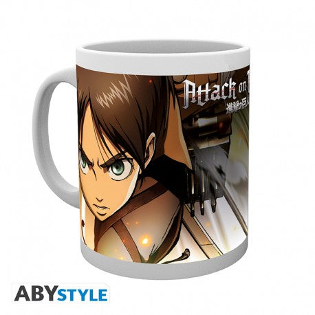 A white ceramic mug with a graphic print of a character from the anime Attack on Titan, featuring text and a scene of the character in a combat suit.