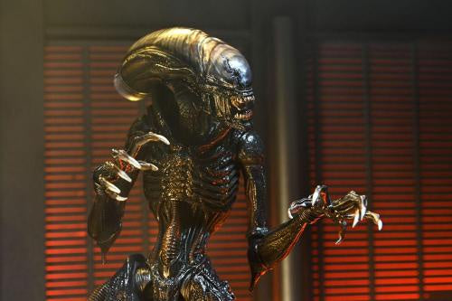 Alien creature figure with a red background