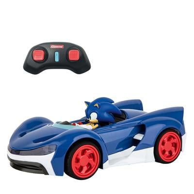 Toy sonic in a remote control car on a white background