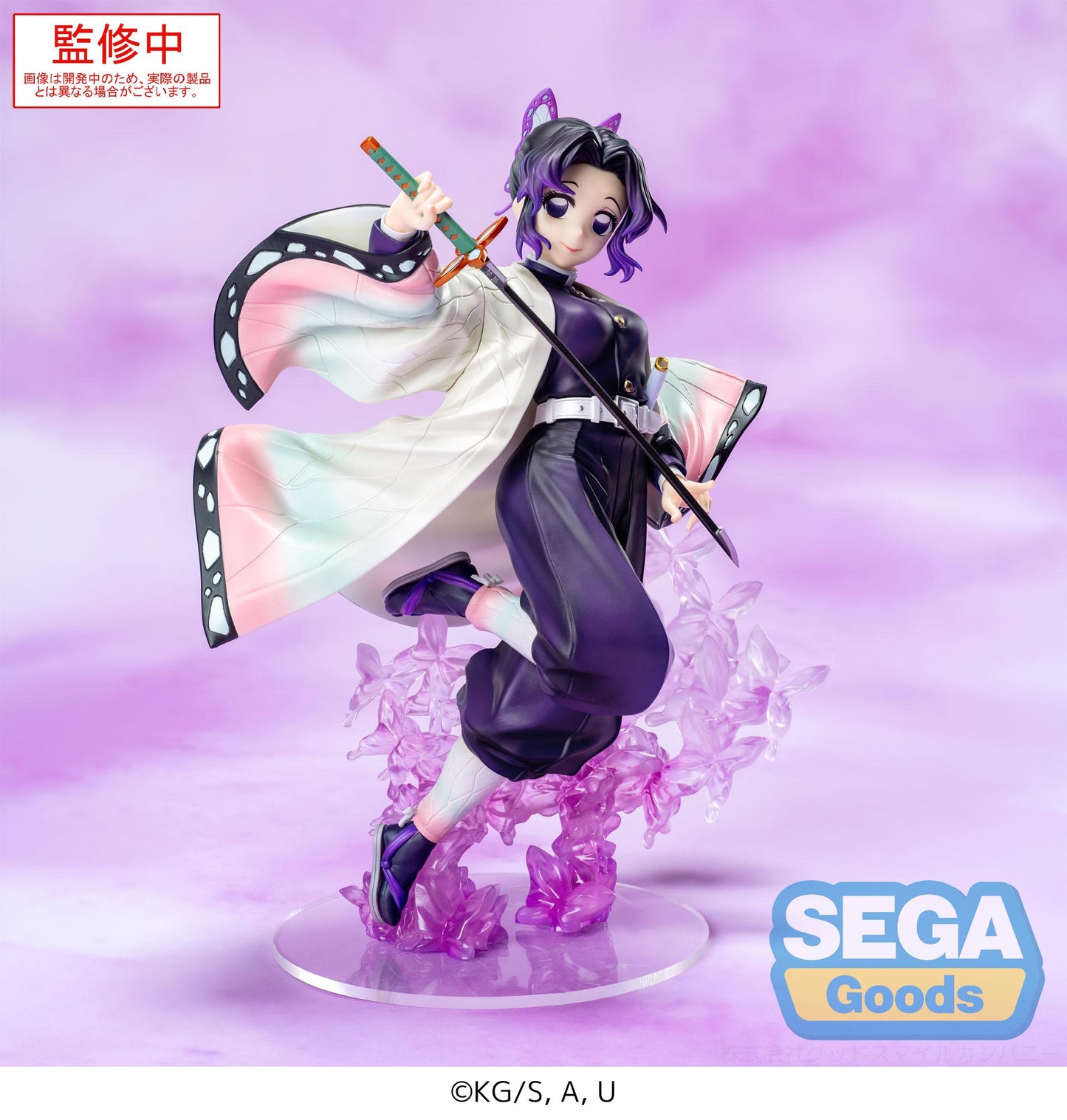 Figurine of an animated character with a sword on a purple background, featuring the Sega Goods logo.