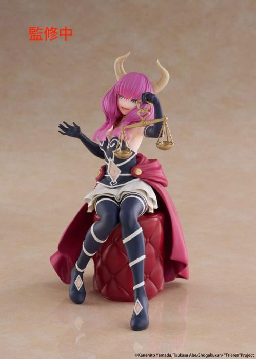 Figurine of a character with pink hair and a red cape holding a scale on a beige background