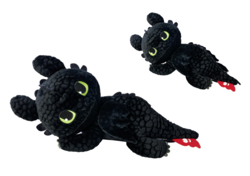 Two black plush dragon toys with green eyes and red accents on a white background