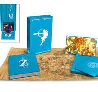 Blue book with a silhouette design on a wooden surface with a colorful card in the background.