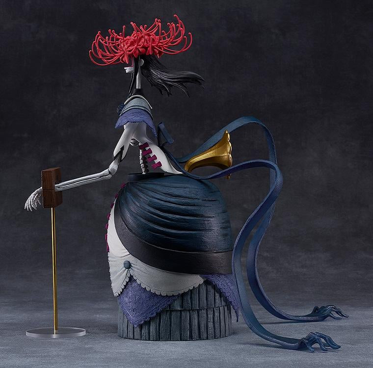 Detailed figurine with a red flower on a dark background