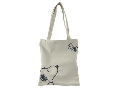 Beige tote bag with black illustrations on a white background