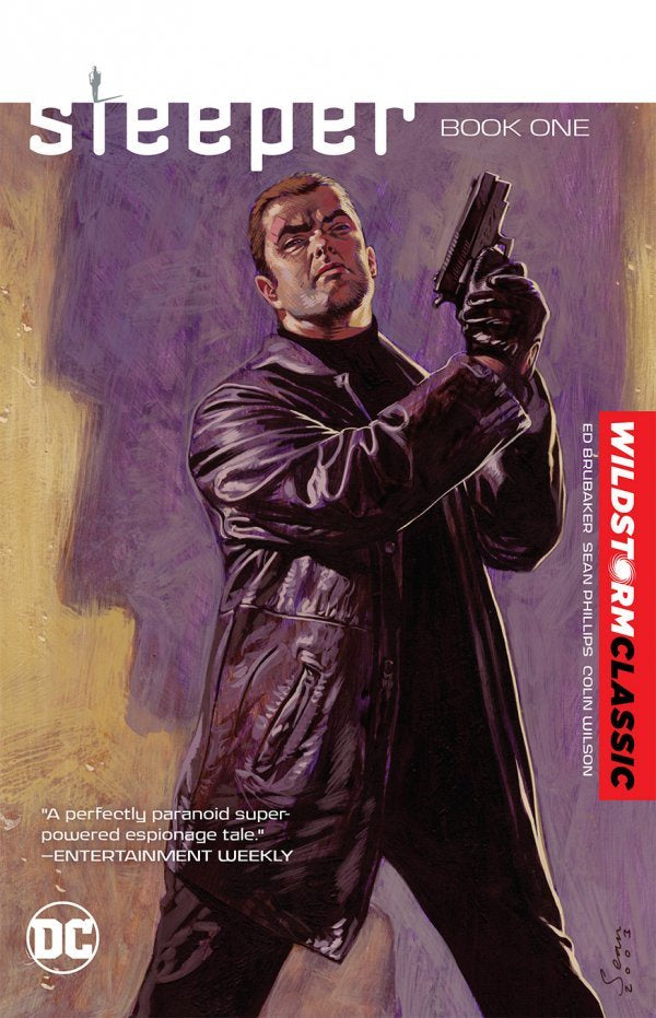 Comic book cover of 'Sleeper' Book One with a character holding a gun.