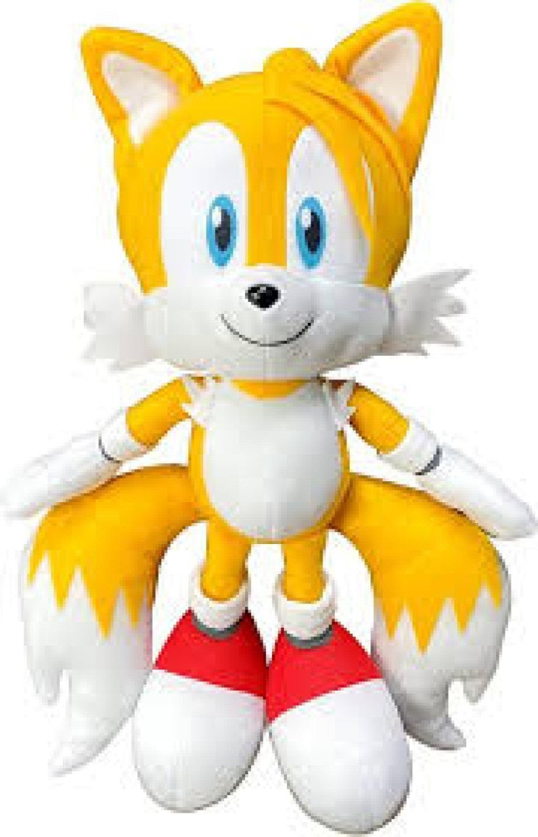 Plush toy of a character with yellow fur, blue eyes, and red shoes on a white background