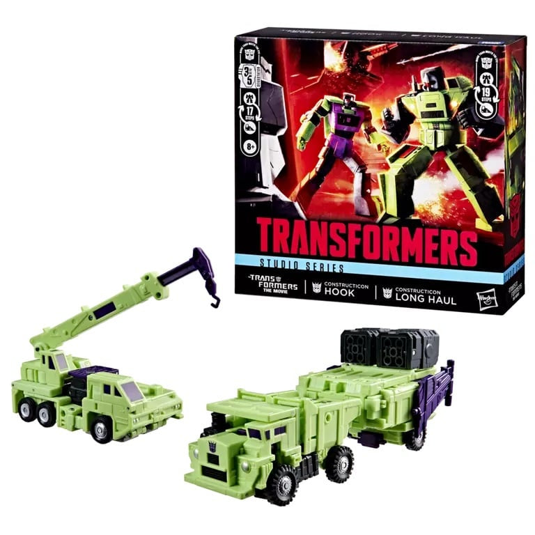 Transformers toy figure with crane attachment next to its packaging