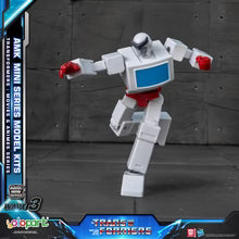 Toy robot figure with red and blue accents on a dark background, featuring AMK Mini Series branding.
