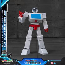 Transformers robot model kit with AMK Mini Series branding on a dark background