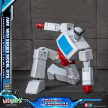 Transformers model kit with AMK Mini Series branding on a dark background