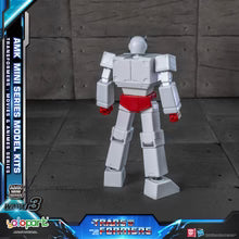 Transformers model kit with AMK Mini Series branding on a dark background