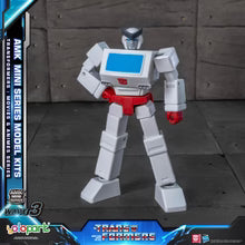 Transformers toy figure with AMK Mini Series branding on a dark background