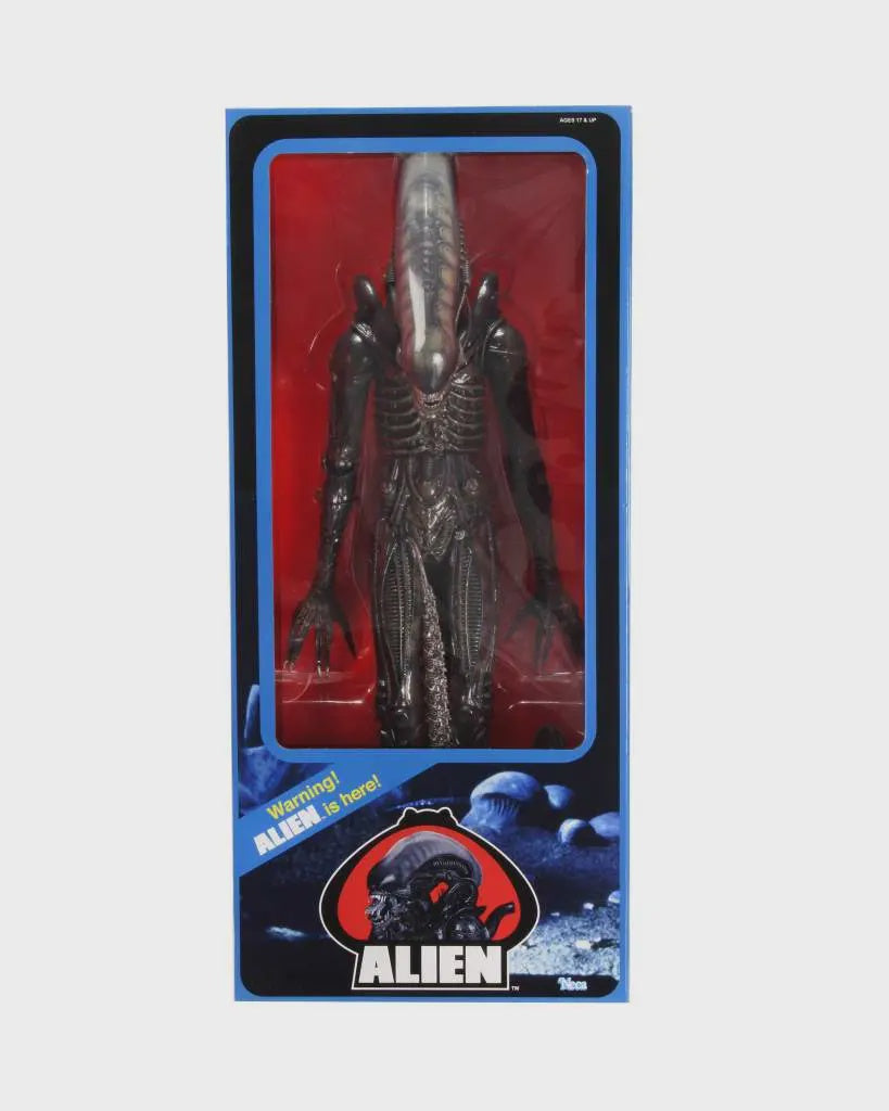 Action figure in packaging with 'Alien' branding on a white background