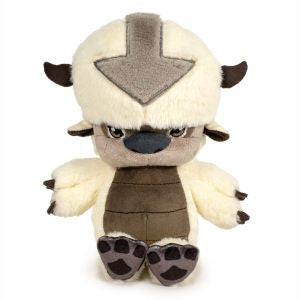 Plush toy resembling a character with a white face, brown body, and black accents on a white background