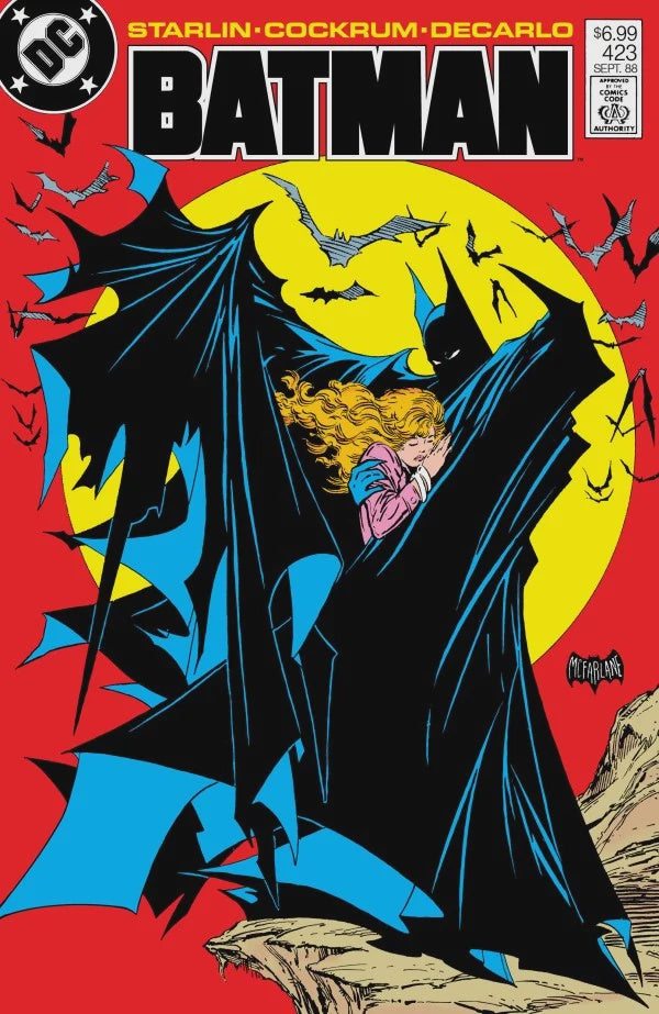 Batman comic book cover featuring Batman in a large black cape embracing a blonde woman against a bright yellow full moon and red background, with the DC logo and large BATMAN title at the top.
