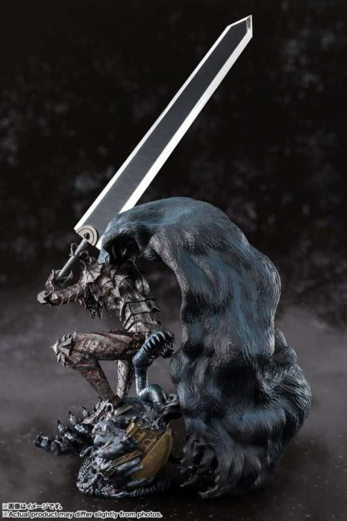 Statue of a creature with a sword on a dark background