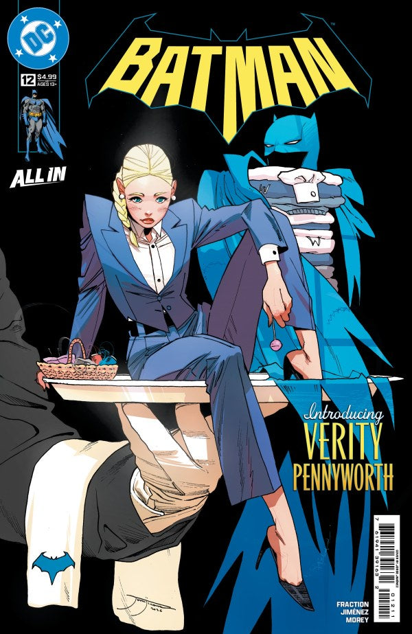 Batman All-In issue 12 cover featuring a stylized illustration of a blonde woman in a blue suit seated at a table, with Batman in blue and black behind her. The DC logo appears in the top left, and the title BATMAN is prominently displayed at the top.