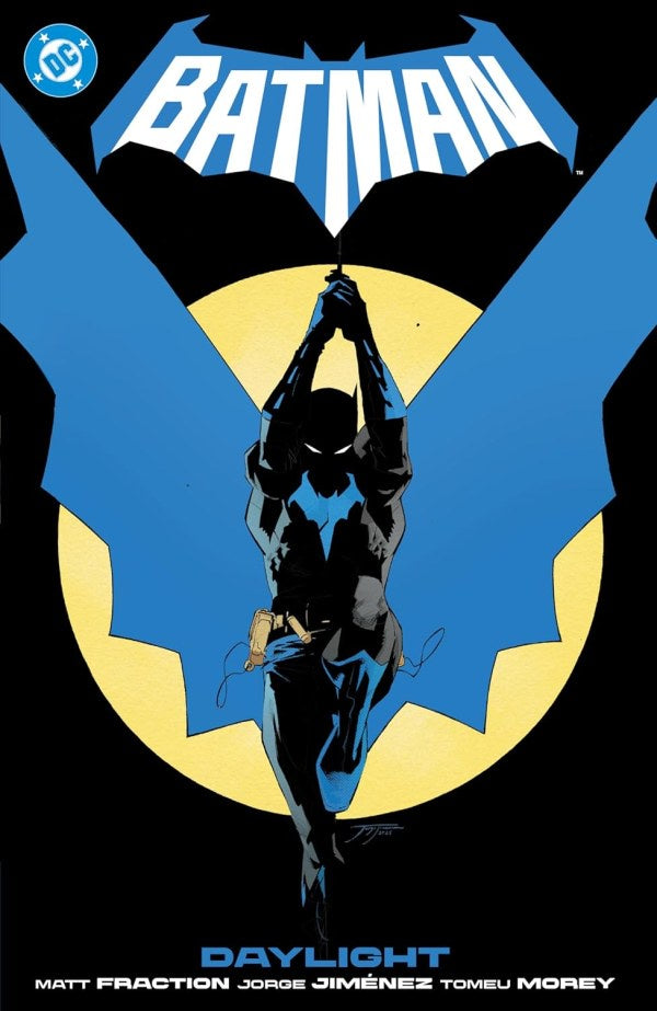 Batman comic book cover with superhero silhouette and blue bat emblem