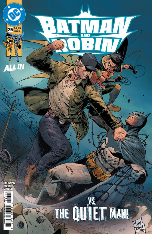 Batman and Robin #26 Comic book cover featuring Batman and Robin fighting 'The Quiet Man' with DC logo.