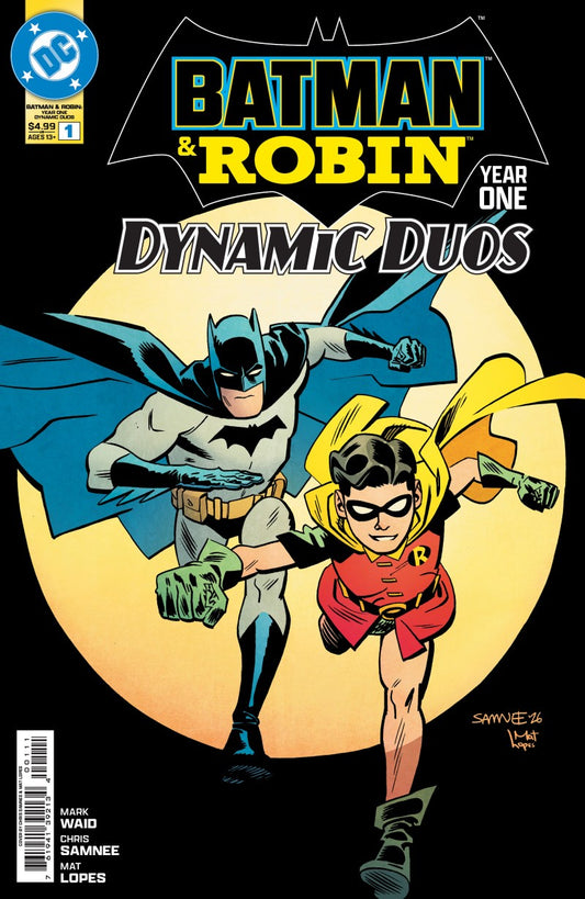 Front cover of the comic book Batman & Robin Year One: Dynamic Duos, featuring Batman and Robin flying in front of a large yellow moon on a black background. The DC logo is visible in the top left corner.