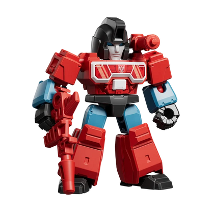 Toy robot figure with red, blue, and black colors on a white background