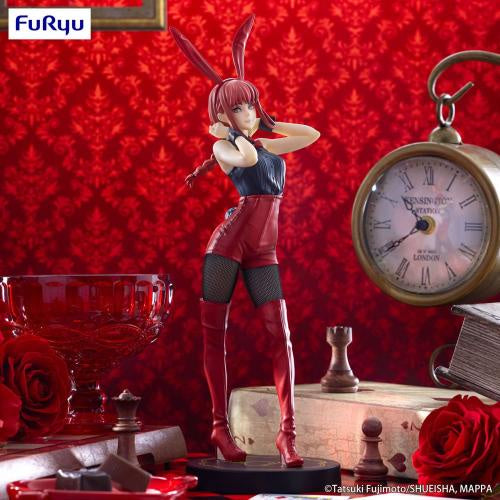 Anime character figurine with red hair and bunny ears against a red patterned wall with decorative items.