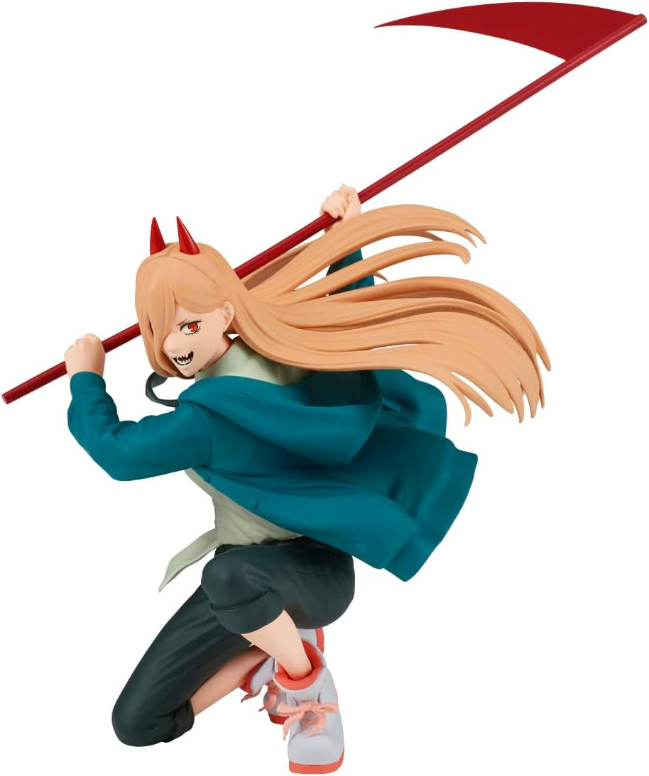 A figurine of a character with orange hair, wearing a green jacket, holding a red pole. The character is in a dynamic pose, depicting movement.
