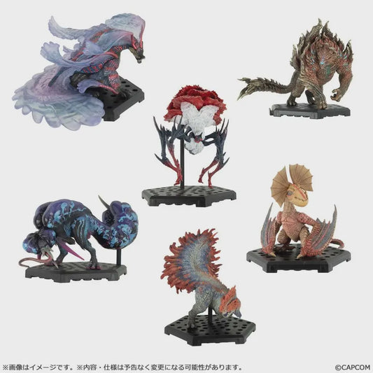 Collection of colorful fantasy creature figurines on a white background