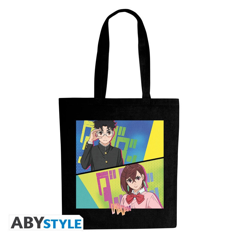 Black tote bag with anime-style illustration of two characters on a colorful background, featuring the ABYSTYLE brand.