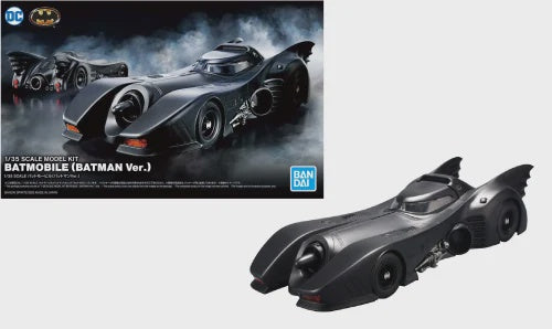 Model kit of a Batmobile with packaging on a white background