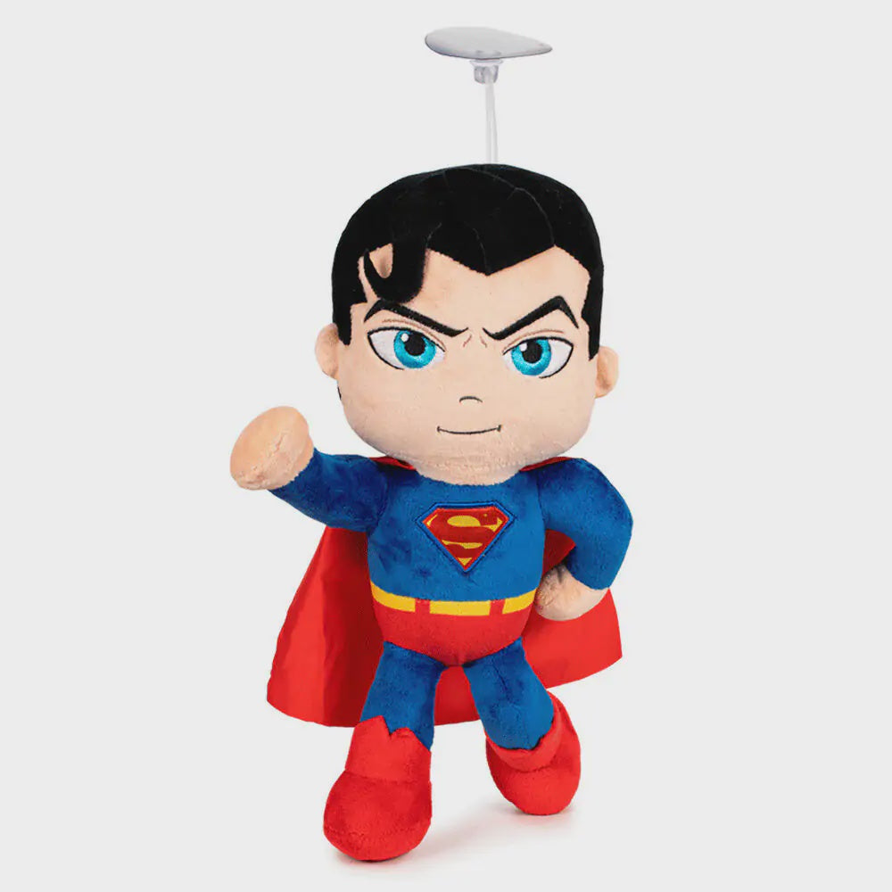 Plush toy resembling a superhero character with a red cape and blue suit on a white background