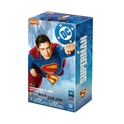 Superman action figure packaging with DC logo on a white background