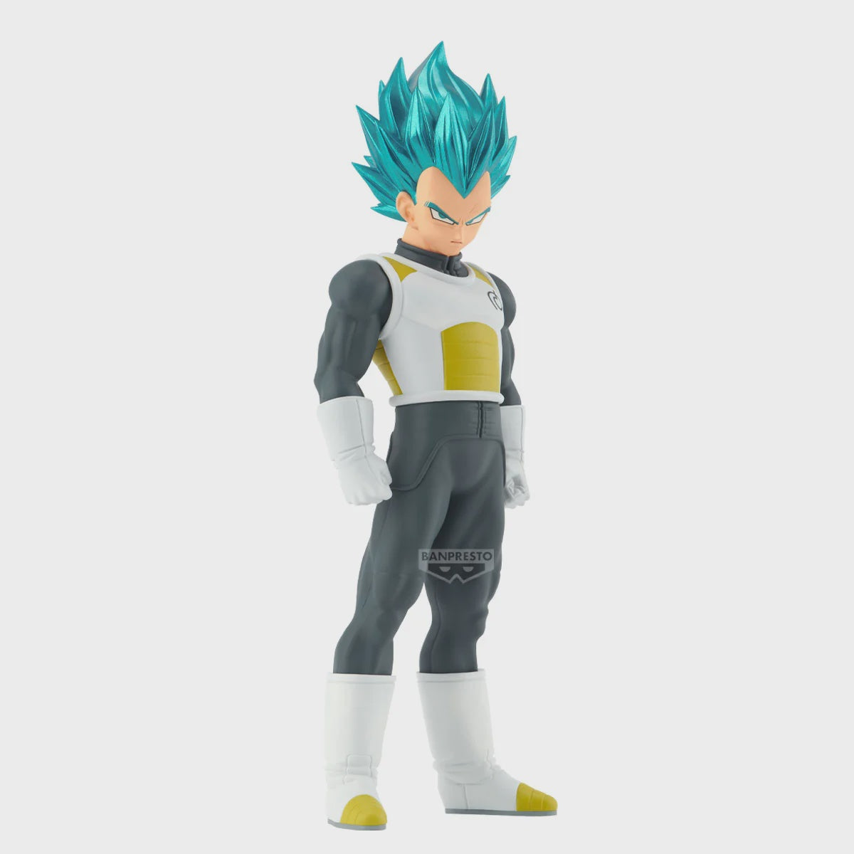 Action figure with blue hair and gray suit on a white background