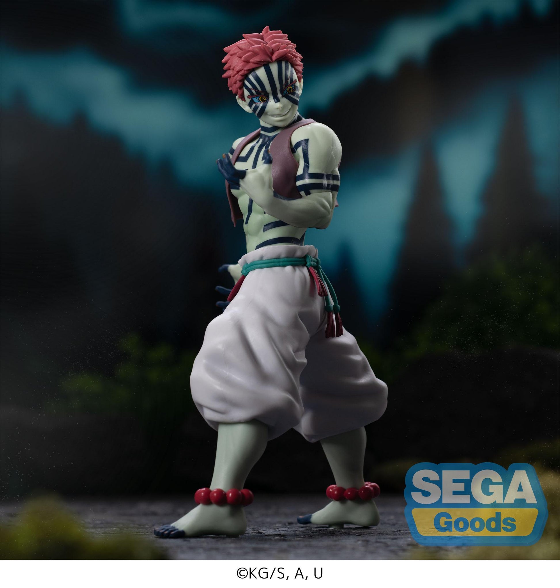 Action figure with zebra-like pattern and red hair against a dark forest background, featuring SEGA Goods logo.