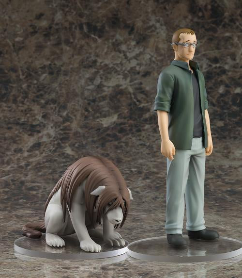 Two figurines of a person and a lion on a textured brown background