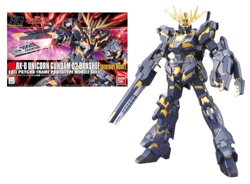 The image shows a model kit of the GUNDAM RX-0 Unicorn 02 Banshee Destroy Mode, which is a plastic mecha model from the Japanese Gundam franchise. The model is in a destroy mode with a gray and gold color scheme, and it is displayed next to its packaging.