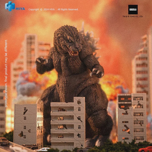 Godzilla toy figure in front of a cityscape with explosions