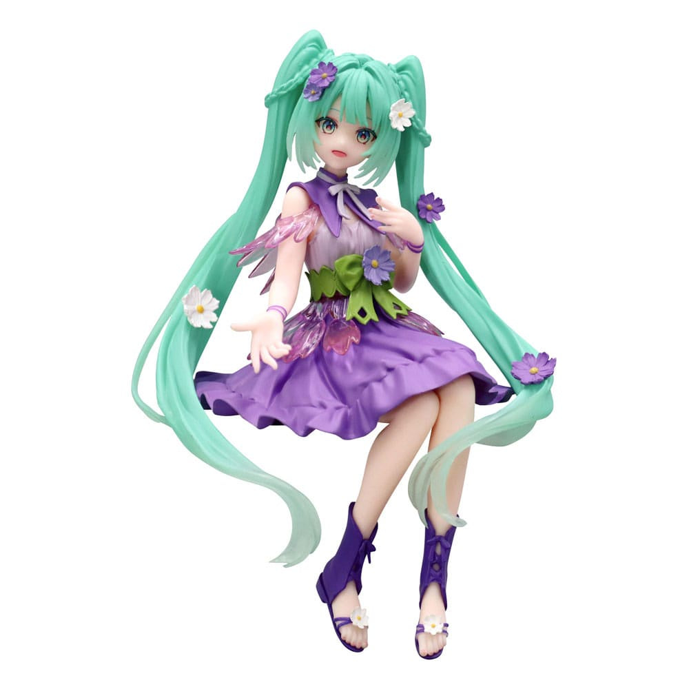 Anime character figurine with long green hair and a purple outfit on a white background