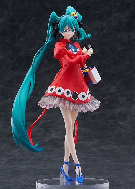 Figurine of a character with teal hair and a red outfit on a dark background