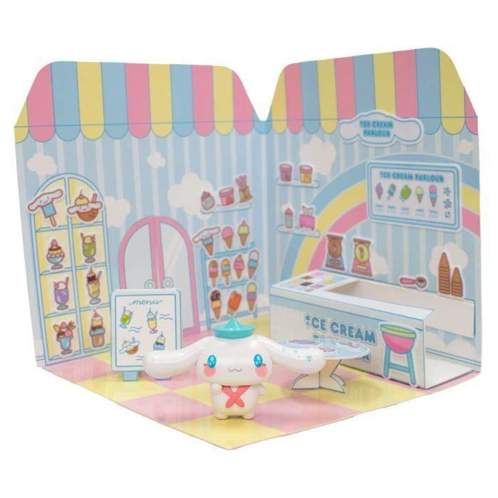 Toy figure of a character with a hat in front of a colorful ice cream parlor toy set packaging.