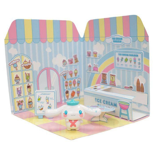 Toy figure of a character with a hat in front of a colorful ice cream parlor toy set packaging.