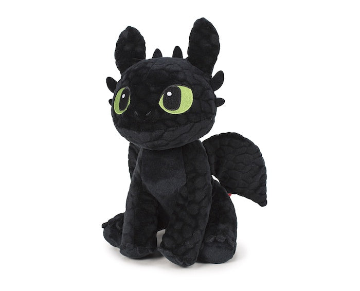 Black plush dragon toy with green eyes on a white background