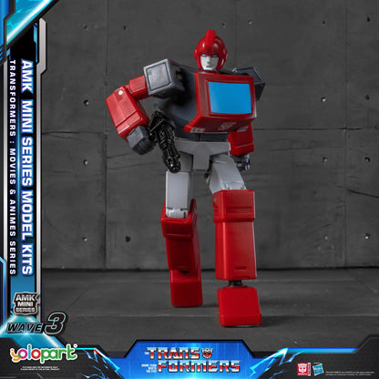 A red and gray Transformers mini-series model kit figure standing against a dark gray concrete wall backdrop, with promotional text and logos for Wave 3, YoloPark, and Transformers visible on the frame edges.