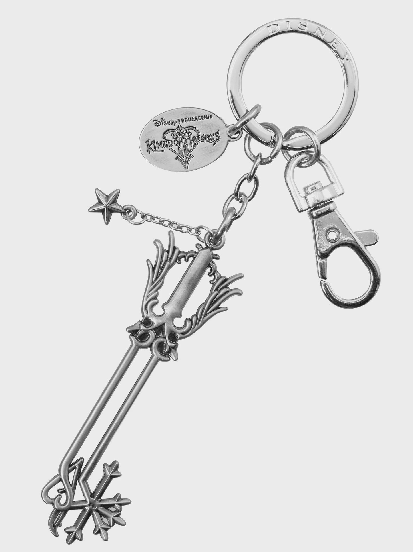 Silver key-shaped keychain with a hook on a white background