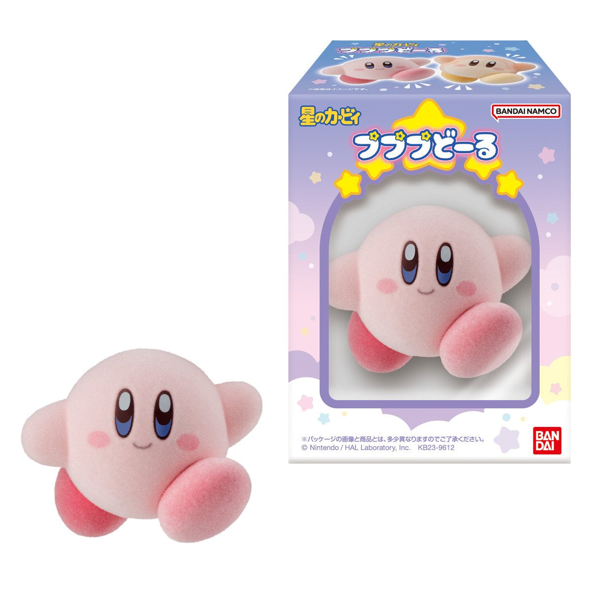Pink plush toy with blue eyes next to its packaging on a white background