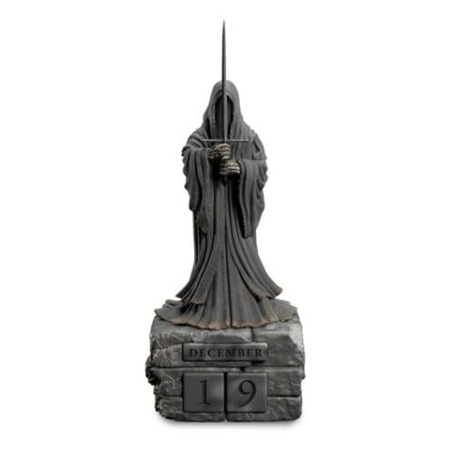 Statue of a hooded figure holding a sword on a pedestal with 'December 19' engraved, on a white background.