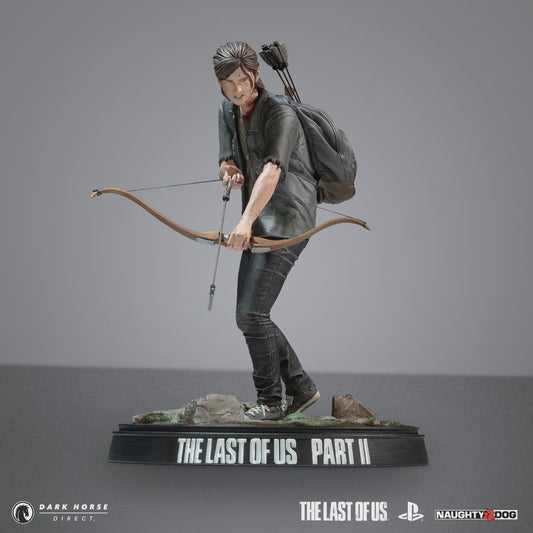 Statue of a character from 'The Last of Us Part II' with a bow and arrow on a gray background