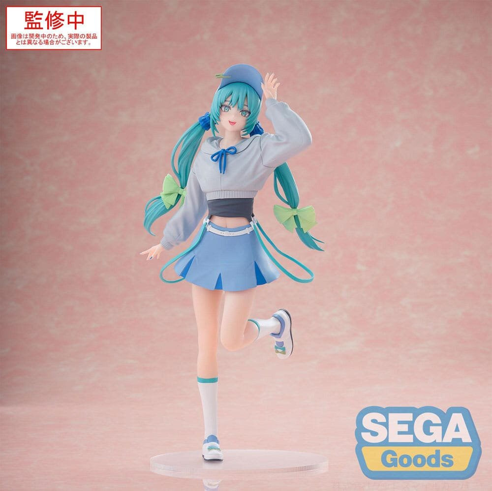Figure of a character with blue hair and outfit on a pink background with Sega Goods logo.
