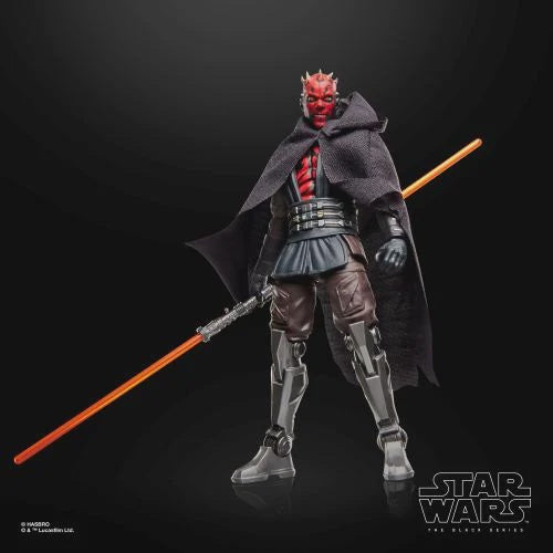 Star Wars The Clone Wars Darth Maul action figure holding a double-ended orange lightsaber, posed against a dark studio background with the Star Wars logo in the corner.